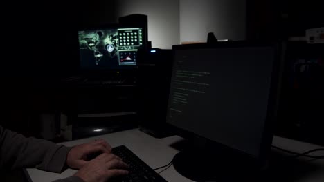 computer hacker typing in code