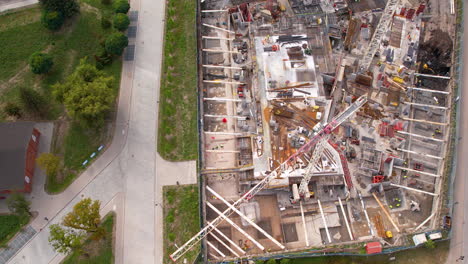 aerial of a large construction site with cranes in gdansk, poland