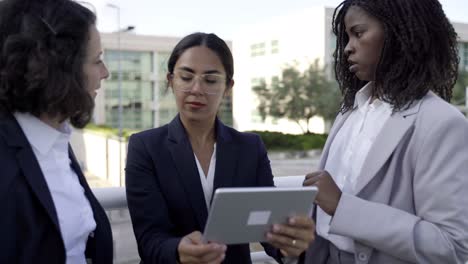 serious businesswomen with tablet pc