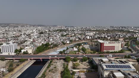 jaipur city growth illustrated through flyover and metro projects. aerial shot of jaipur city with crowded buildings