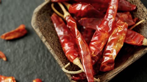 dried red chili pepper in bowl 4k