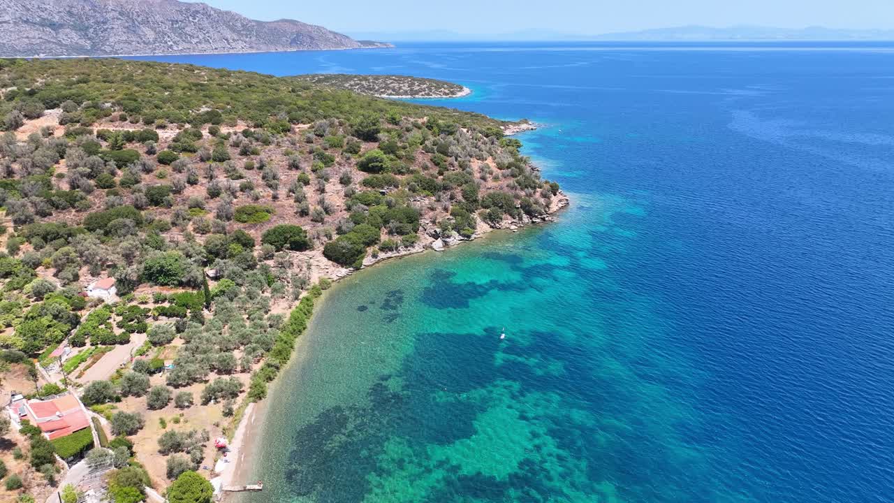 Aerial footage of the colorful waters of the Aegean sea on Samos island