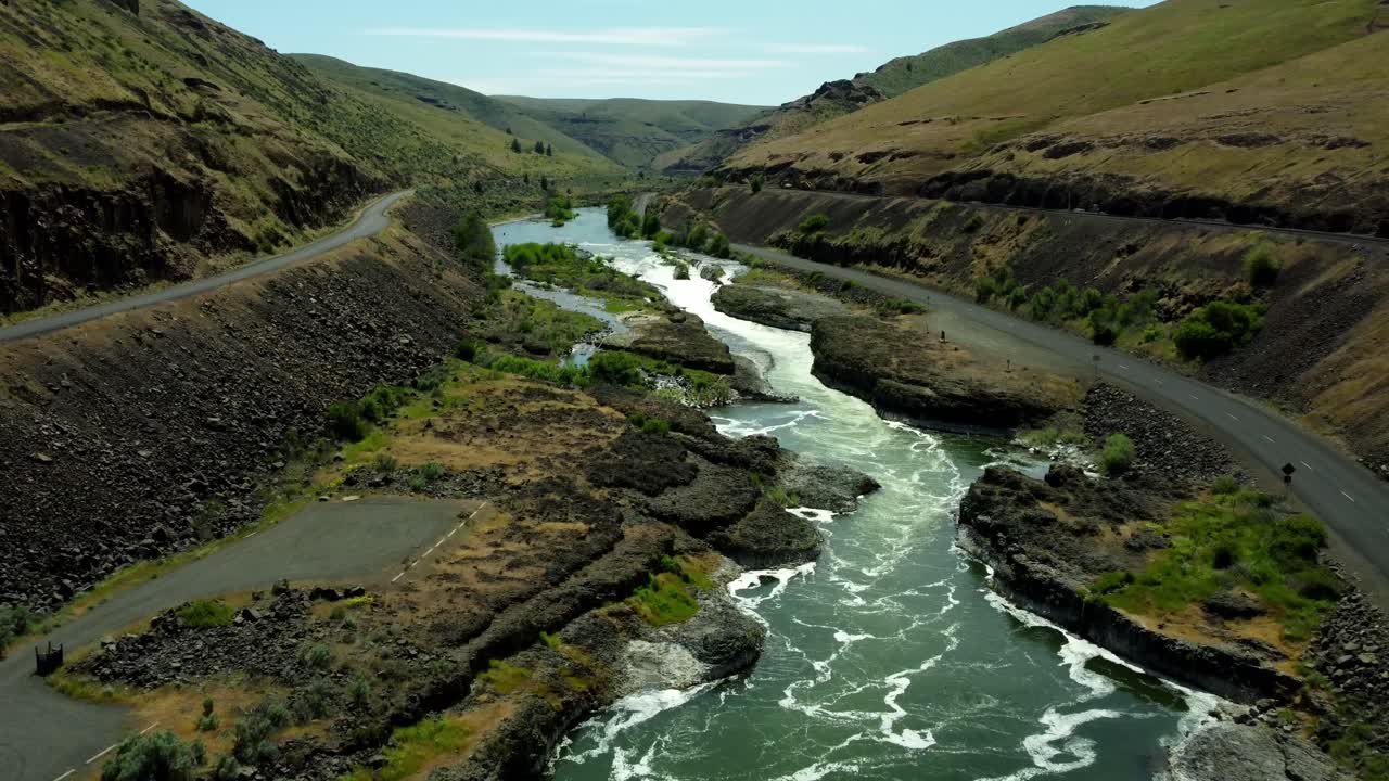 US, Oregon, Maupin, Sherar's Falls, 2025-05-08 - Drone view over the Deschutes River in spring with tribal fishing platforms over the river and a fish ladder. In north central Oregon