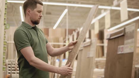 man shopping for flooring in a hardware store