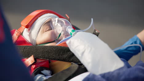 Paramedic,-ambulance-and-patient-with-oxygen-mask