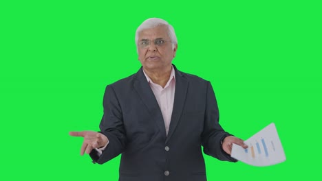 Angry-Indian-senior-manager-shouting-on-employees-Green-screen