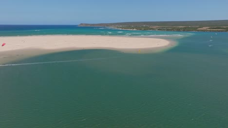 aerial view of witsand breede river, south africa, kitesurfers in motion