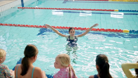 swimming lesson with children in a pool