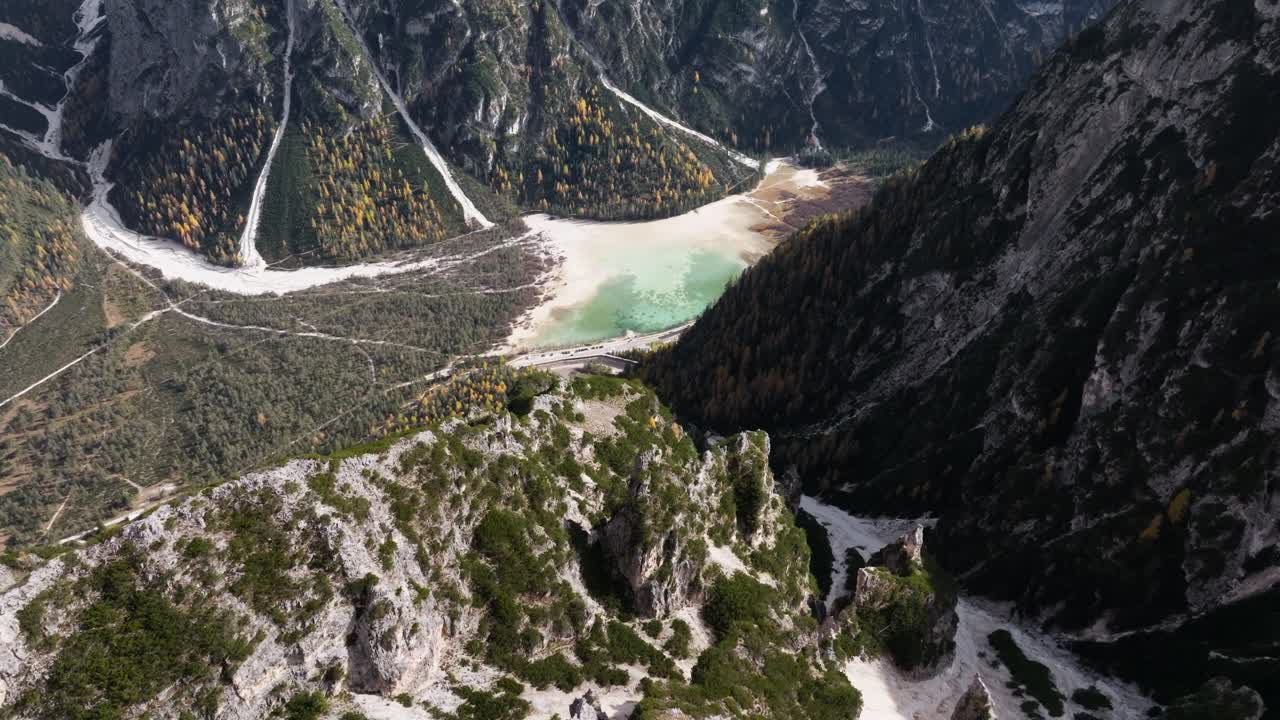 Drone clip of Landro lake in the Italian Dolomites captured at the end of October while autumn was peaking