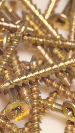 macro shot of selftapping screws in a furniture workshop use of fasteners when working with wood macro shot of selftapping screws in a furniture workshop the use of fasteners when working with wood and plasterboard slow motion