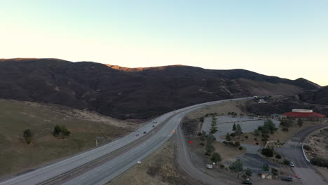 cars travel on tejon pass in southern california, drone view