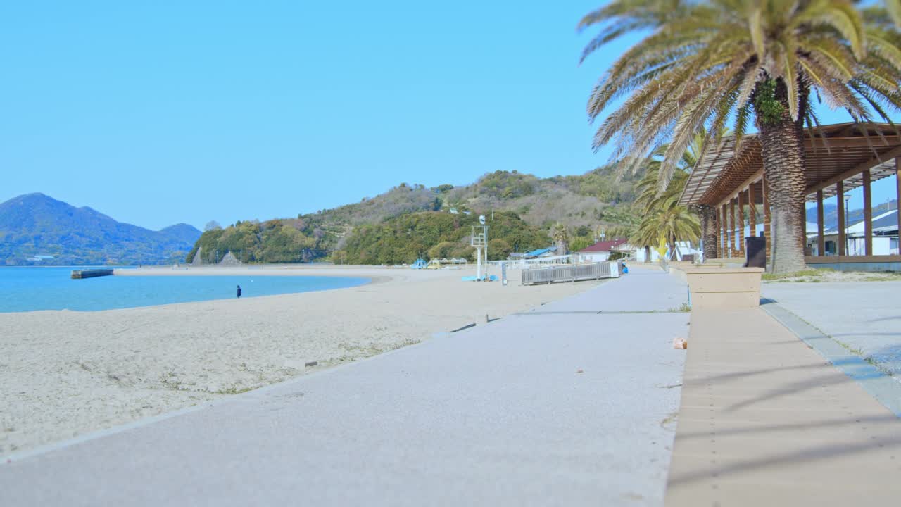 Beach with palm trees and blue sky. Seto Inland Sea Beach