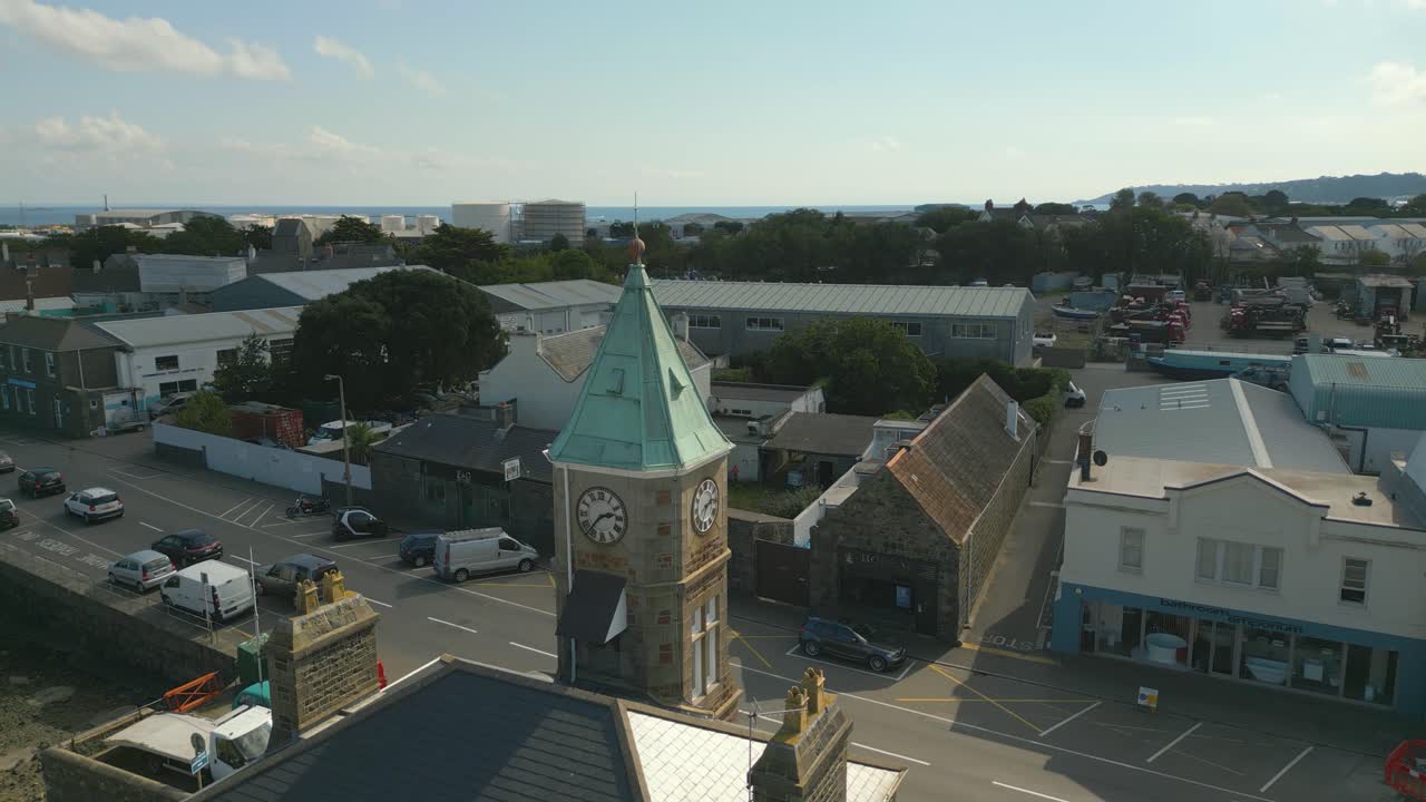 Static aerial drone footage of Clock Tower St Sampson&rsquo;s harbour Guernsey looking across Southside and beyond