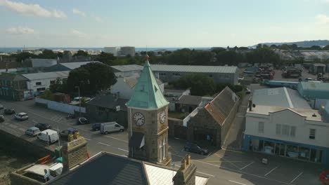 Static-aerial-drone-footage-of-Clock-Tower-St-Sampson’s-harbour-Guernsey-looking-across-Southside-and-beyond