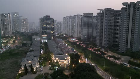 Drone-shot-flying-forward-over-Nha-Be-District-with-lots-of-high-rise-building-and-moving-traffic-at-sunset