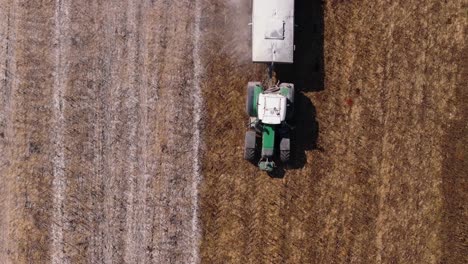 Above-View-Of-A-Tractor-Attached-With-Water-Sprinkler-Tank-For-Controlling-Dust