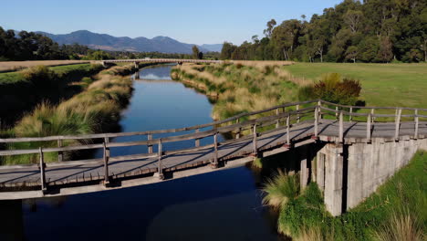 scenic river landscape with bridge and mountains