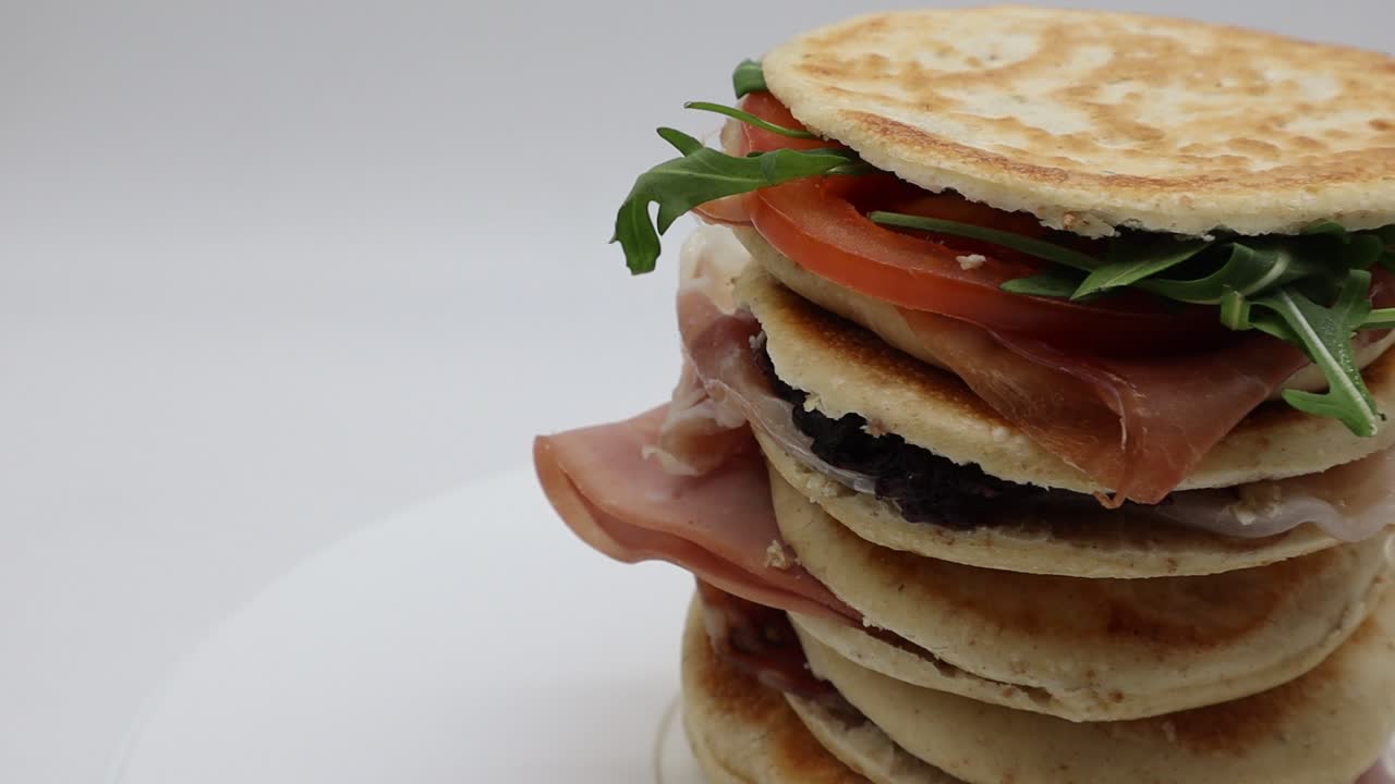 Delicious Italian Tigelle on turntable. Traditional Italian food