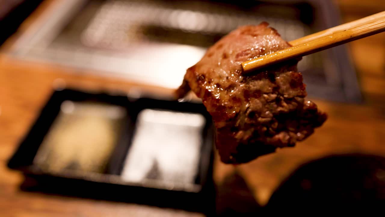 Juicy steak piece being turned on a skewer