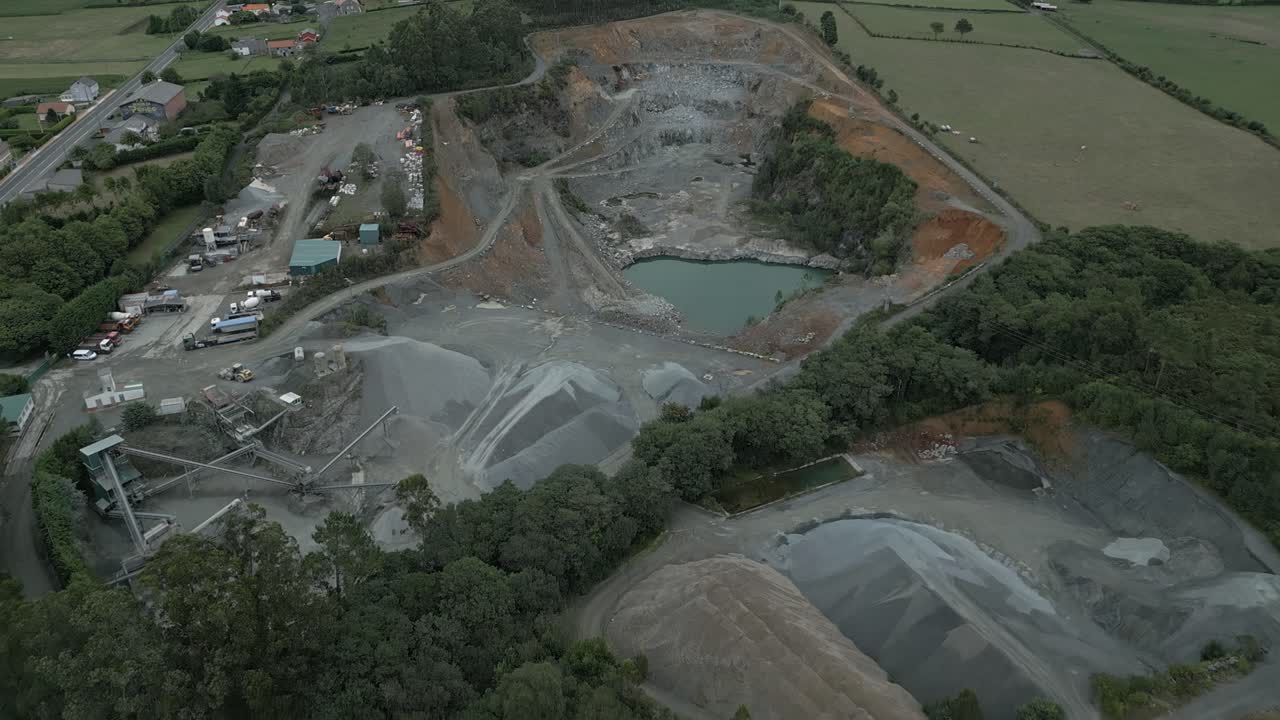 Aerial high angle shot flying over quarry in Mil de Baixo, Moeche, Spain