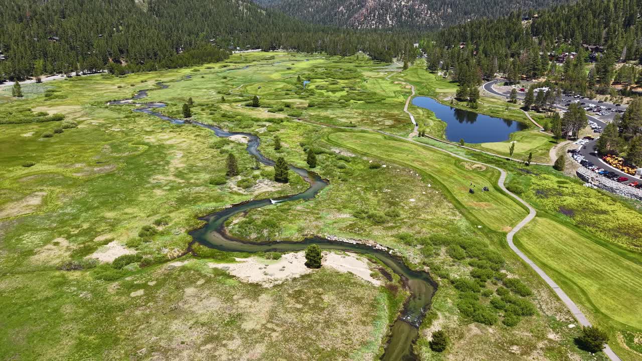 Drone Shot of Creek and Green Landscape of Olympic Valley, Lake Tahoe Ski Resort in Summer Season, California USA