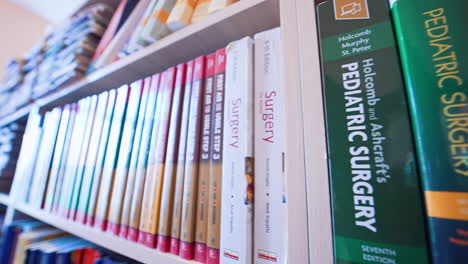 shots of books inside university library. bookshelves in university library with lots of books