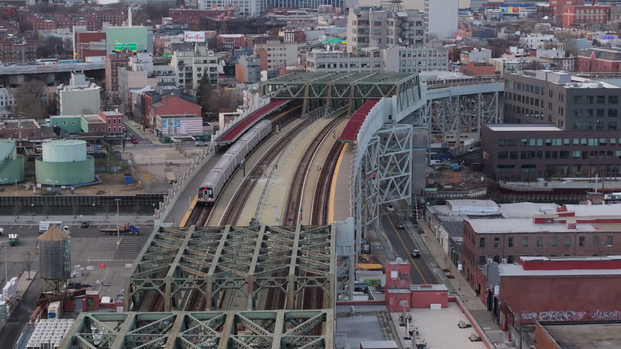 Aerial view of the subway on an elevated railway track in Brooklyn. Shot on an overcast day in Gowanus.