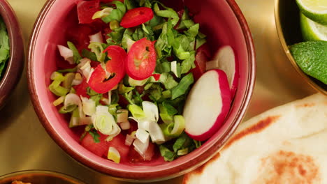 close-up view of a delicious spicy curry served in a colorful bowl with a spoon, ready for a tasty meal.
