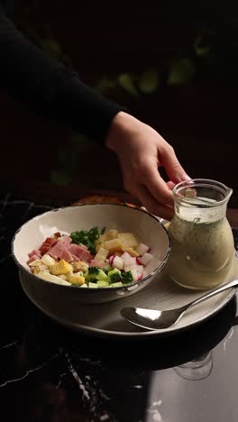 woman serving okroshka cold soup