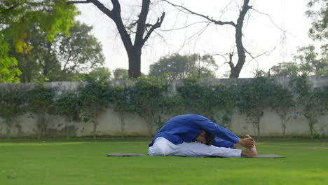 Head-to-knee-yoga-pose-done-by-an-Indian-man