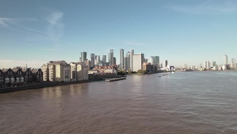 wide angle sunset aerial of the canary wharf buildings in london
