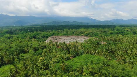 huge stack of garbage in jungle near magelang, indonesia, aerial view