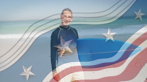 Multiple-stars-on-blue-stripes-against-portrait-of-caucasian-man-carrying-surfboard-at-the-beach