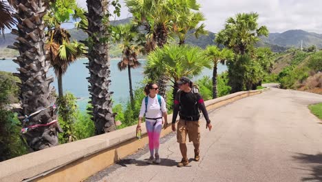 couple hiking along coastal path with scenic views