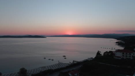 drone shot a sunrise over the beach in greece