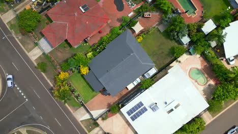 top down aerial drone shot of small houses in a residential neighbourhood