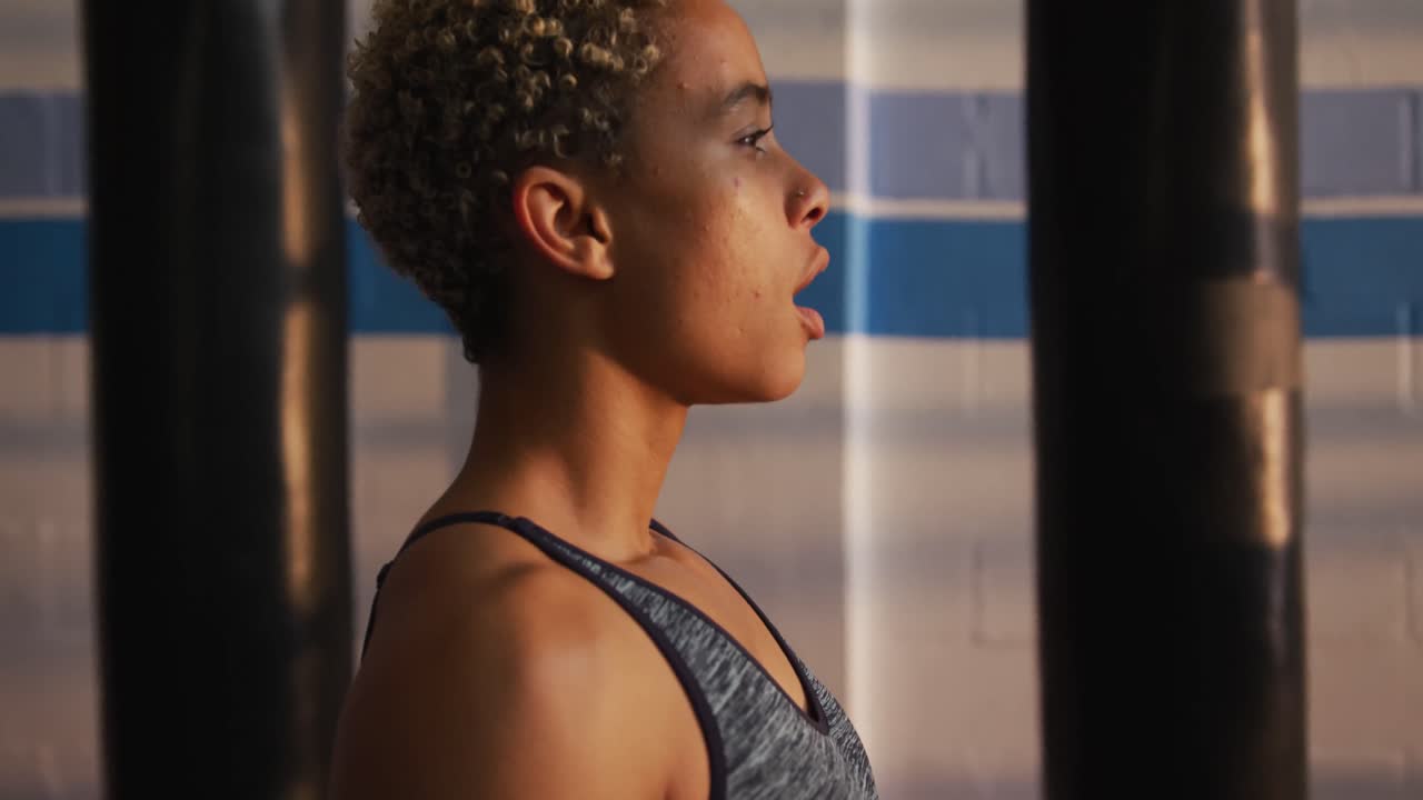 Close up view of fit woman in boxing gym