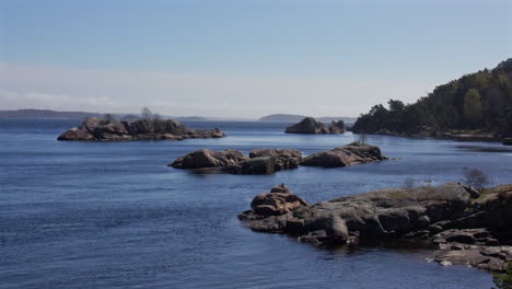wide shot of a calm inland sea and rocks at odderøya in kristiansand