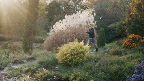 The-boy-runs-through-the-picturesque-autumn-park.-Beautiful-autumn-day