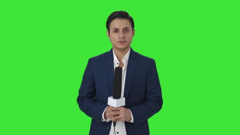 Portrait-of-Confident-Indian-reporter-Green-screen