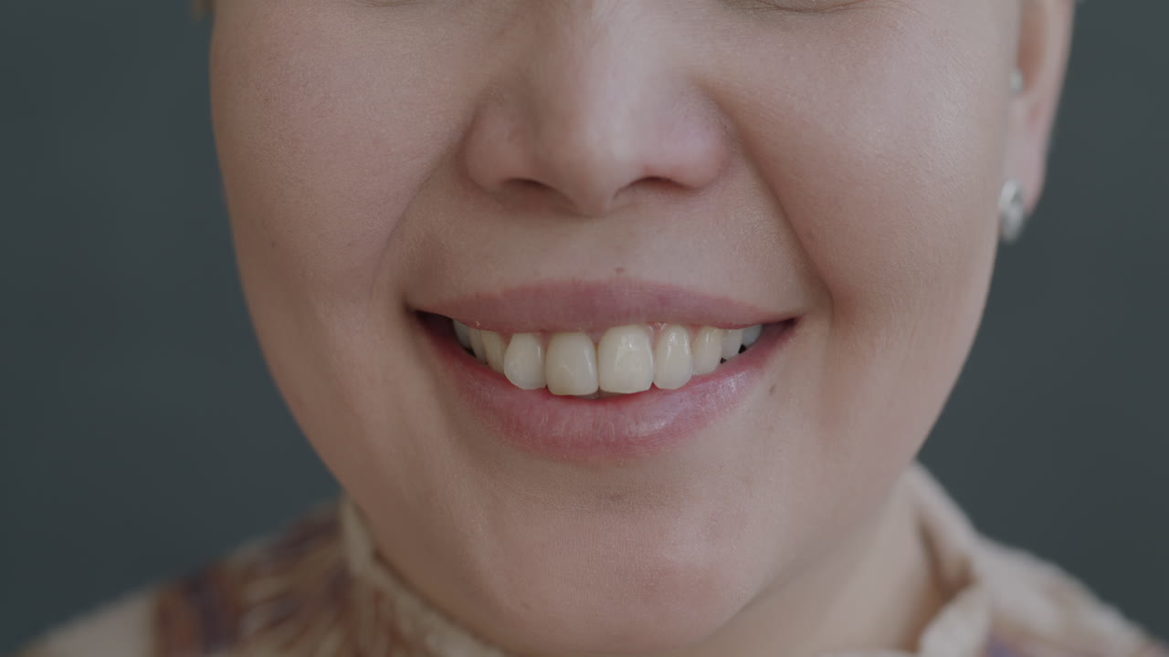 Close-up of a smiling woman's mouth
