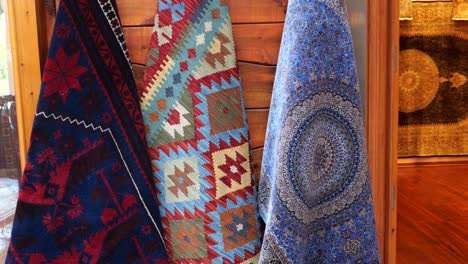 colorful hand-woven carpets on display