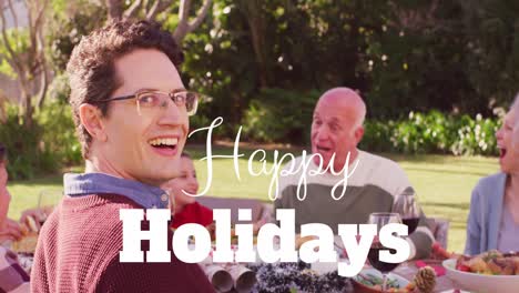 animation of christmas greetings text over caucasian family at christmas table