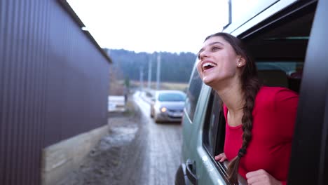 woman looking out of car window