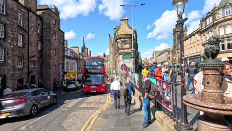 double-decker bus navigating busy street in edinburgh