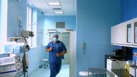 doctor and nurse running in passageway of hospital