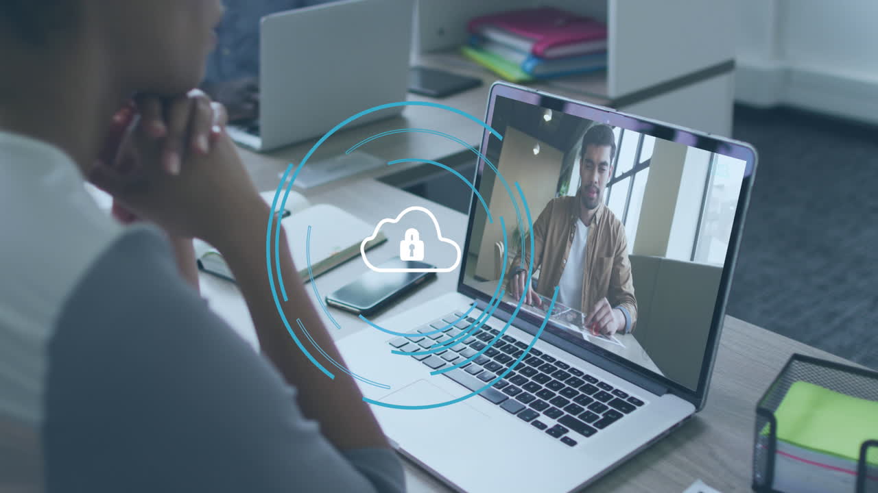 Animation of cloud icon over diverse business people on laptop video call in office