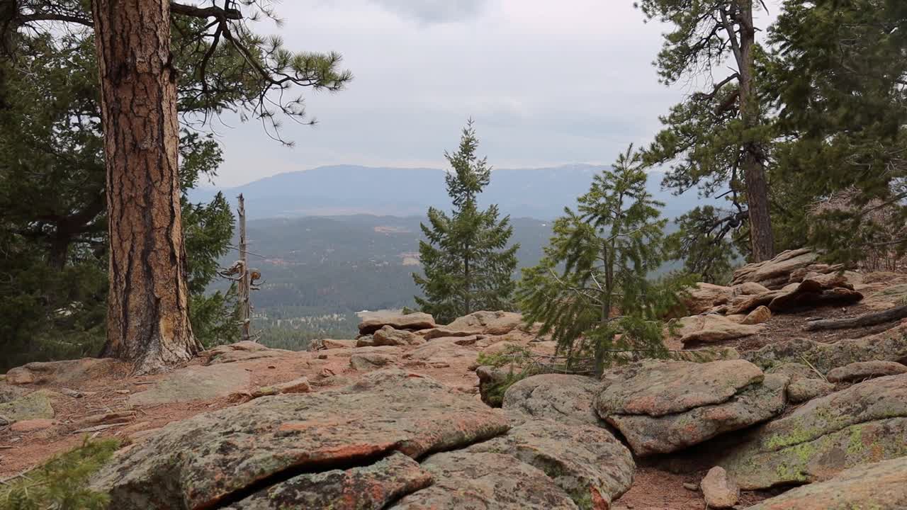 An empty, remote mountain viewpoint filmed in windy and cloudy weather. Filmed in Staunton State Park during the spring.