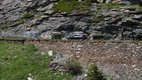 Car-driving-along-mountain-and-rural-road