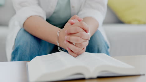 bible, prayer and hands of a woman in house